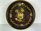 a decorative tray with flowers on it on a table