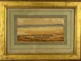 une vieille photo représentant un tableau représentant une ville, dans un cadre doré