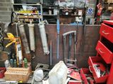 a garage with tools and tools on the floor