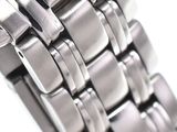 an image of a close up of a wrist watch on a white surface