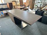 an image of a table in a room with a lot of furniture in the background
