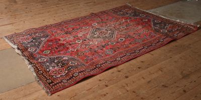 a rug on the floor in the middle of the room