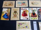 a lot of postcards that are on the table