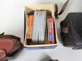 a box with a lighter and a pair of shoes next to it