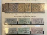 several different types of stamps on display in a glass case