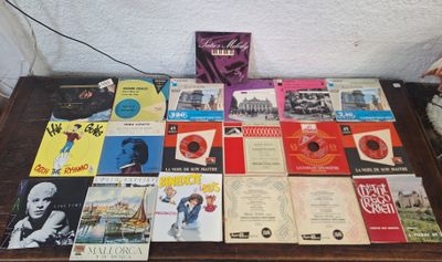 a table that has a lot of books on it