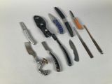 many different types of knives on a white surface