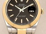 rolex watch with black dial and two tone steel bracelet