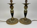 pair of antique brass candlesticks with black and gold accents