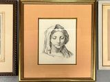 three framed pictures of a woman ' s face and a woman ' s head