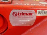 a close up of a red fire hydrant with a sticker on it