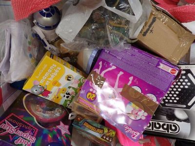 a pile of assorted toys and other items in a pile