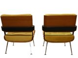 pair of mid century modern lounge chairs in yellow velvet and black leather