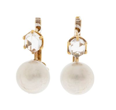 a pair of pearl and diamond earrings on a white background