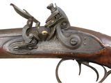 a close up of a gun that is on display on a white background
