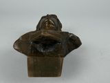 bronze bust of a man with a hat on his head