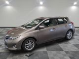 a picture of a silver toyota sienna parked in a garage