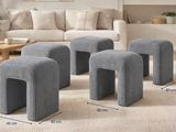 three stools and a table in a living room with a couch and a coffee table