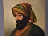 an oil painting of a man with a beard and a turban on an easel