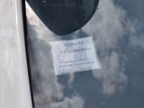 a parking meter with a sticker on the side of it