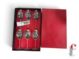 six wine glasses in a box on a table