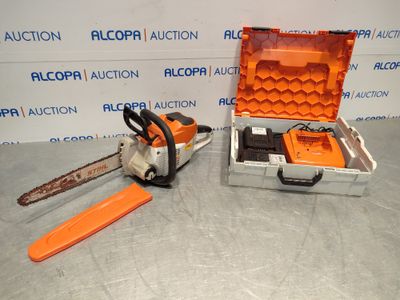 a close up of a chainsaw and a tool case on a table