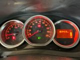 three gauges on the dashboard of a car