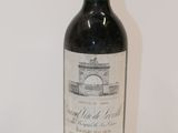 a bottle of wine that is sitting on a table
