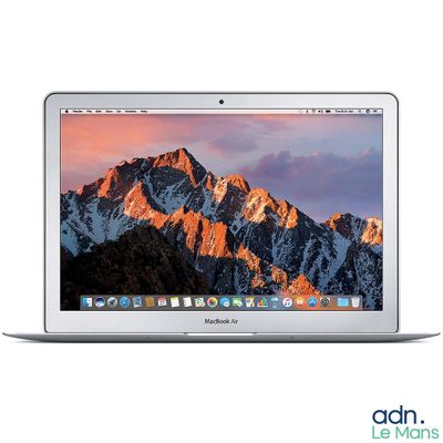 an apple macbook air laptop computer with a mountain range in the background