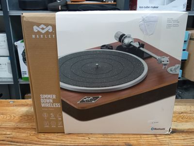 a box with a record player on it sitting on a table