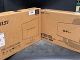 two boxes of electronic equipment sitting on top of a table