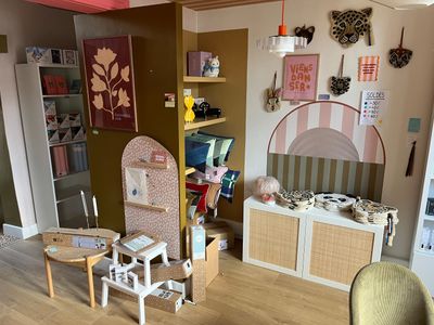 two chairs and a table in a small room