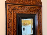 a mirror hanging on the wall above a sink