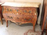 a dresser with a marble top in a room