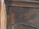 a close up of a wooden door with peeling paint