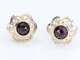 pair of garnet stone stud earrings in 14k yellow gold