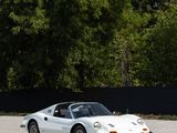 an image of a white sports car parked in a parking lot