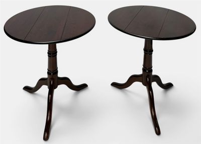 a pair of tables with a wooden top and two legs