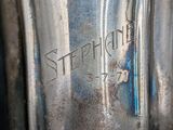 a close up of a silver blender on a table