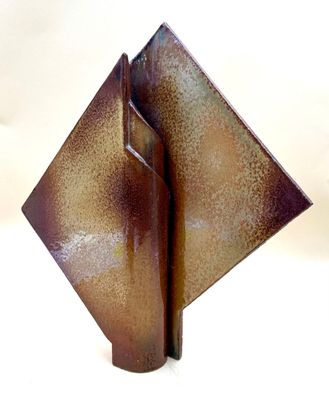 a metal sculpture of a square shaped object on a white surface