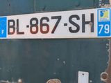 a close up of a license plate on the back of a truck