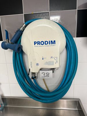 a blue hose attached to a wall in a bathroom