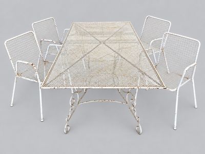 an image of a table with four chairs around it on a gray surface