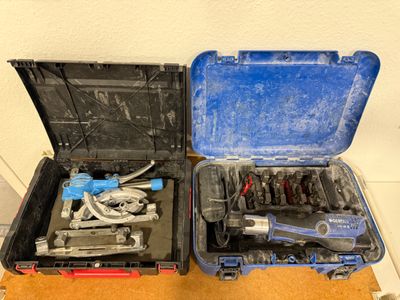 two tools in a case sitting on a table