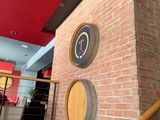a brick wall with a clock on it in a building