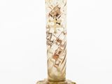 a glass vase that is sitting on a table