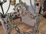 a metal cage with a clock on top of it