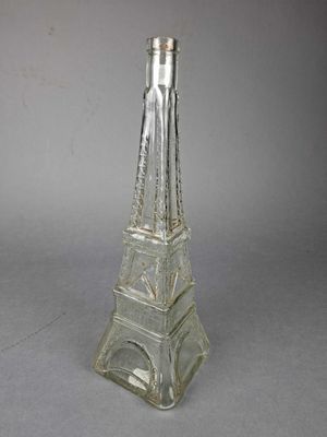 BOUTEILLE publicitaire en verre moulé représentant la Tour E…