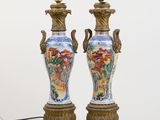 two vases that are sitting on a table