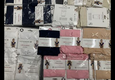 a pile of men ' s underwear on display in a store